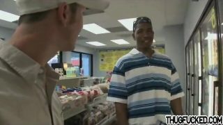 Black thug sucks white cock in a store